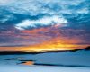Wilderness landscape photography of a golden sunset over Alum Creek in Yellowstone National Park in Winter